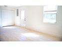 Sunlit room featuring neutral paint, closet, and tile floors at 4840 Transport Rd, Bartow, FL 33830