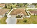 Expansive aerial view of a cozy home with a well-maintained yard and a fenced perimeter at 639 Mesilla Dr, Kissimmee, FL 34758