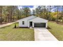 Aerial view of the front of a new construction home with a dark grey roof at 12380 Sw 71St Lane Rd, Ocala, FL 34481