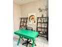 Bright office area, enhanced with shelves, books, and a green desk at 1828 Lemon Drop Ct, Apopka, FL 32712