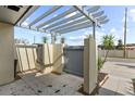 Enclosed patio area with neutral tones, complemented by a modern pergola and well-maintained concrete pavers at 2539 Antilles Dr, Winter Park, FL 32792