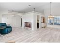 Bright living room with wood floors, white walls, and archway feature, blending modern style at 2540 Courtland Blvd, Deltona, FL 32738