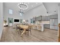Bright living space showcasing a modern kitchen, dining area, and living room at 2940 Scarlett Dr, St Cloud, FL 34772