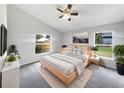 Bright bedroom features a ceiling fan, neutral walls, and natural light from the two windows at 332 Lake Doe Blvd, Apopka, FL 32703