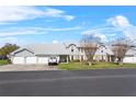 Well-maintained townhome with a tidy front lawn, private garages, and lovely curb appeal at 5273 Tunbridge Wells Ln # 1601, Orlando, FL 32812
