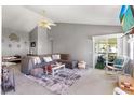 Spacious living room with a large sectional sofa, stylish decor, and access to a screened lanai at 5273 Tunbridge Wells Ln # 1601, Orlando, FL 32812