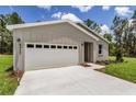 Single-story home boasting a two-car garage, neutral siding, and a well-maintained lawn at 8459 Sw 138Th Ter, Dunnellon, FL 34432
