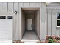 Inviting entryway featuring a neutral color scheme and modern light fixtures at 8459 Sw 138Th Ter, Dunnellon, FL 34432