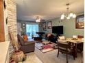 Inviting living room featuring neutral paint, ceiling fan, and dining area at 8830 Coral Palms Ct # A, Kissimmee, FL 34747