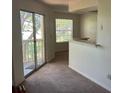Bright living room with sliding glass door and window at 1013 S Hiawassee Rd # 3626, Orlando, FL 32835