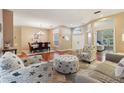 Bright open living and dining area featuring hardwood floors and stylish beach-themed furniture at 1232 Scandia Ter, Oviedo, FL 32765