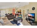Spacious living area featuring tile flooring, neutral paint, and an open layout perfect for entertaining at 151 Castaway Beach Way, Kissimmee, FL 34746