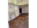 Spacious living room features hardwood floors, fireplace and traditional chandelier at 1811 S Westmoreland Dr, Orlando, FL 32805