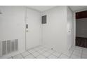 Bright foyer with tiled floors, a white door, and access to other rooms at 200 Maitland Ave # 86, Altamonte Springs, FL 32701