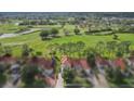 Aerial view showcasing a sprawling golf course and the home's prime location at 2630 Albion Ave, Orlando, FL 32833