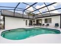 A beautiful screened-in pool offers the perfect place to relax and entertain at 2930 Paddington Way, Kissimmee, FL 34747