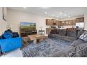 Open-concept living room adjoining kitchen, featuring comfortable seating and modern decor at 4353 Lana Ave, Davenport, FL 33897