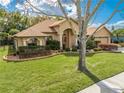 Attractive single-story home boasting lush landscaping, well-kept lawn, and a convenient two-car garage at 4933 Raylene Way, St Cloud, FL 34771