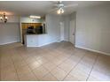 The open living space shows tile flooring and the eat-in kitchen area with lots of natural light at 5959 Westgate Dr # 1526, Orlando, FL 32835