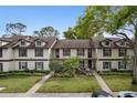 Townhouse exterior with symmetrical design, featuring balconies and lush landscaping at 600 Northern Way # 502, Winter Springs, FL 32708