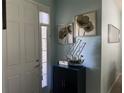 Charming foyer with artwork, a ship model, and ample natural light at 6832 Sw 93Rd Ave, Ocala, FL 34481