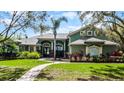Charming home featuring lush landscaping, a brick walkway, and a well-maintained lawn at 701 Palenci Ct, Winter Springs, FL 32708