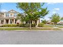 Lovely two-story home with a covered front porch and lush landscaping enhancing curb appeal at 8255 Bryce Canyon Ave, Windermere, FL 34786