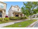 Charming two-story home featuring a covered front porch and landscaped yard at 8255 Bryce Canyon Ave, Windermere, FL 34786
