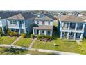 Attractive two-story home with well-maintained lawn, charming front porch, and neat landscaping at 15036 Willow Arbor Cir, Orlando, FL 32824