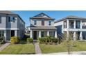 Inviting two-story home features a cozy front porch and well-manicured lawn and landscaping at 15036 Willow Arbor Cir, Orlando, FL 32824