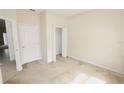 Bedroom with neutral carpeting, closet, and interior door at 17519 Blessing Dr, Clermont, FL 34714