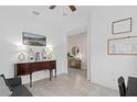 Cozy living room featuring neutral paint and trim, tile floors, and plenty of space to enjoy at 2091 Brillante Dr, St Cloud, FL 34771