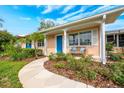 Charming home featuring stone walkway and a delightful front porch at 936 N Baker St, Mount Dora, FL 32757