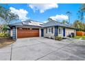 Charming home featuring a two-car garage, solar panels and a concrete driveway at 137 Spring Chase Cir, Altamonte Springs, FL 32714