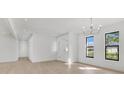 Bright living room with wood floors, recessed lighting, and white walls and trim at 1536 Errol Pkwy, Apopka, FL 32712