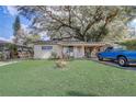 Charming single-story home with mature landscaping and a covered front porch at 1707 Wilton Ave, Orlando, FL 32805