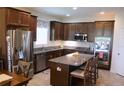 This spacious kitchen has stainless steel appliances, granite countertops, and ample cabinet space at 4110 Arlington Ridge Blvd, Leesburg, FL 34748