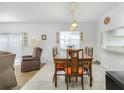 The dining area adjoins the living area, with the kitchen partially visible in the background at 1000 S Semoran Blvd # 511, Winter Park, FL 32792