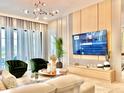 Open living area showcasing a large TV, modern decor, bright lighting, and comfortable seating arrangements at 10012 Voyager Way, Orlando, FL 32821