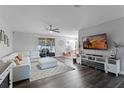 Inviting living room features a comfortable sectional sofa and modern decor at 1865 Sanderling Dr, Clermont, FL 34711