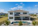 Aerial view of home with pool, fenced yard, patio, and lush lawn perfect for outdoor enjoyment at 2141 Weatherly Way, Orlando, FL 32820