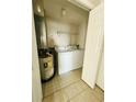 A dedicated laundry room equipped with essential appliances for convenient in-unit washing at 3428 Soho St # 308, Orlando, FL 32835