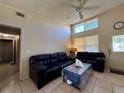 Inviting living room featuring tile floors, ceiling fan, and lots of natural light at 3522 Wd Judge Dr, Orlando, FL 32808