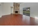 Bright living room featuring wood floors and large sliding glass doors at 3646 Dovetail S Ln, Lakeland, FL 33812
