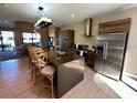Open-concept kitchen with a large island and stainless steel appliances at 7534 Brooklyn Dr, Kissimmee, FL 34747