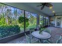 Inviting screened patio with comfortable seating, perfect for enjoying the peaceful outdoor views at 14031 Jomatt Loop, Winter Garden, FL 34787