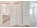 Hallway featuring access to a bathroom and bedroom; includes a closet at 3415 Sagebrush St, Harmony, FL 34773