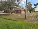 View of a well-maintained home in a residential neighborhood with street access at 721 Waxwing Ct, Kissimmee, FL 34759