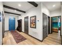 Inviting foyer with wood-look floors, and decorative beams on the ceiling at 1412 Moon Valley Dr, Davenport, FL 33896