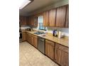 Spacious kitchen featuring wood cabinets, stainless steel appliances, and a tile floor at 15683 Sw 46Th Cir, Ocala, FL 34473